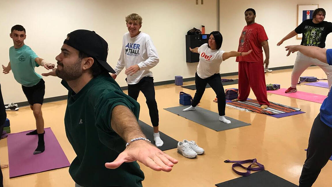 students doing yoga